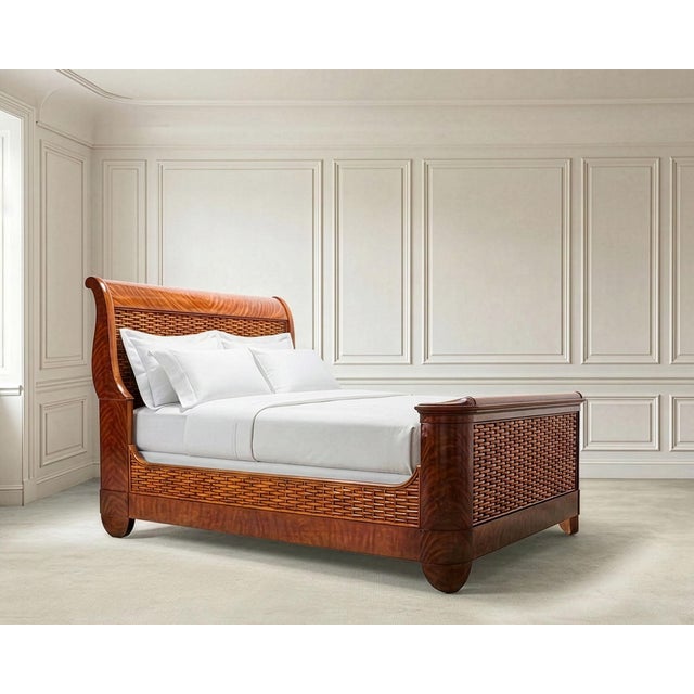 A luxurious and rare labeled Ralph Lauren "Villa America" queen-sized gondola sleigh bed, crafted out of mahogany and...