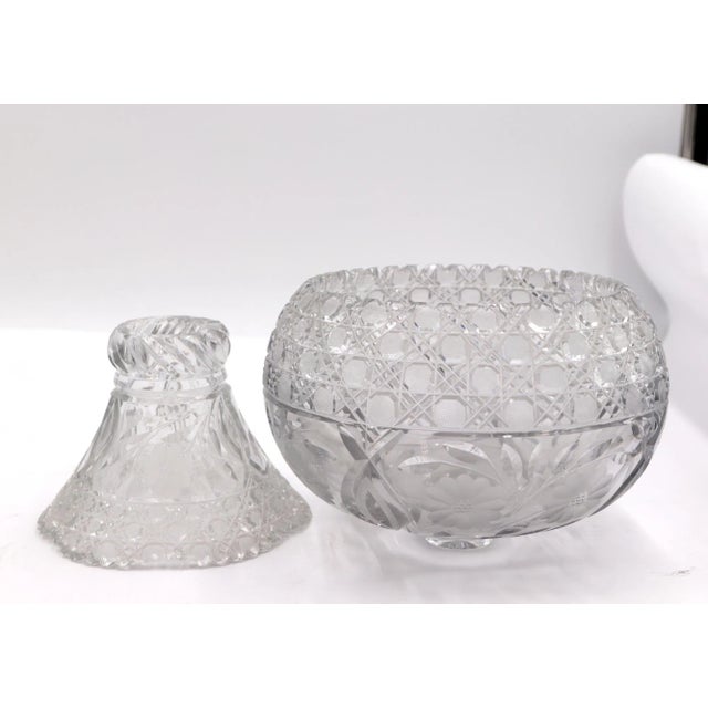 Heavy clear crystal bowl with floral etched details with a matching stand. This is in very good condition, with minor...