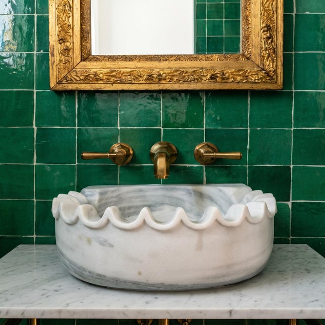 Crafted from natural White Banswara Marble, this scalloped wall mounted sink brings a refined and timeless look to any...