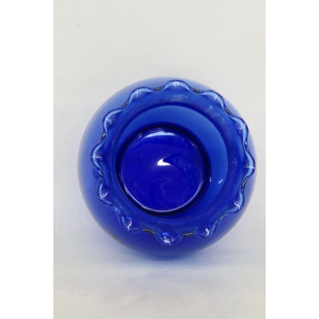 This brilliant Vase is made of glass. This vase has a lovely Mid Century Style, it has a wonderful cobalt blue color to...