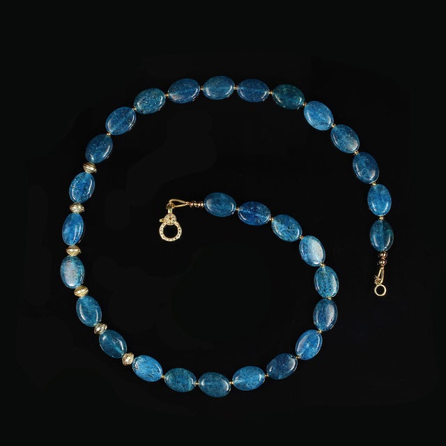 This captivating 19‑inch necklace showcases a strand of smooth, oval apatite tablets, each measuring approximately 14×11...