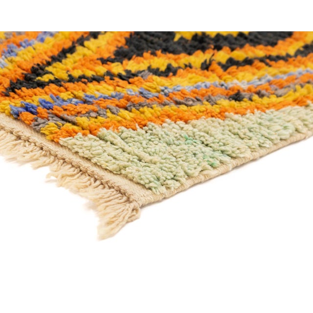 This hand-knotted wool runner rug by Azele Studio features a refined Mint Green base enhanced with bold, layered diamond...