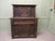 This is an old and charming piece of carved oak furniture, the top section has a single cupboard enclosed by 1 carved...