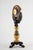 A finely cast 19th-century French Empire-style mantel clock in patinated and gilt bronze, notable for its sculptural...