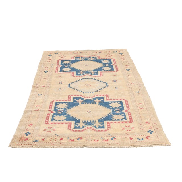 Vintage handknotted washed out Caucasian wool rug. Approximately 60-70 years old. In very good condition.