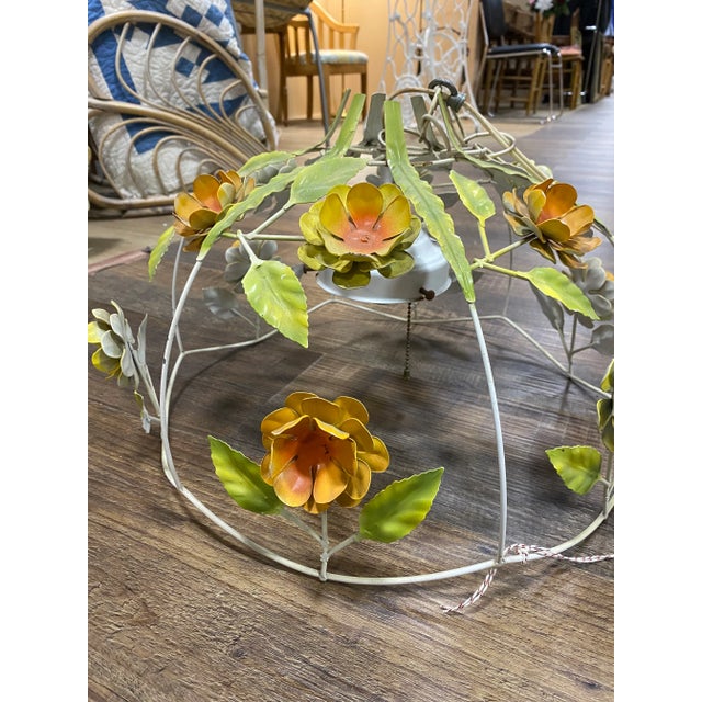 Funky vintage 1970s metal flower chandelier. Round half dome chandelier has a white metal frame with yellow and orange...
