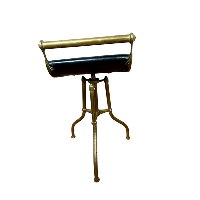 This cool piece is a fully functional swivel music stool that changes height by spinning. It's made of brass and has a...