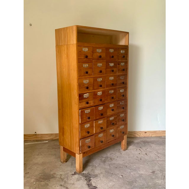 This apothecary bank of drawers was designed and made in Denmark , late 19th century. It is made from solid wood with...