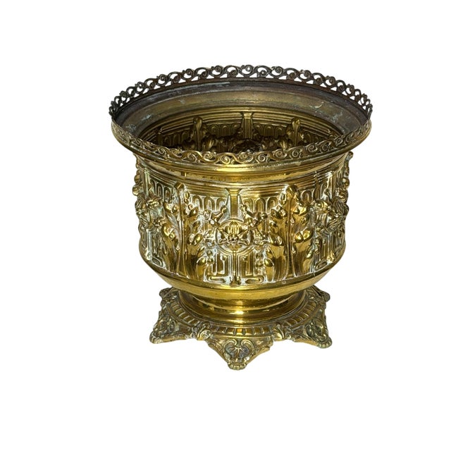 This is an antique French brass planter made 1880-1910, in a Rococo Revival style. It features ornate repousse' and a...