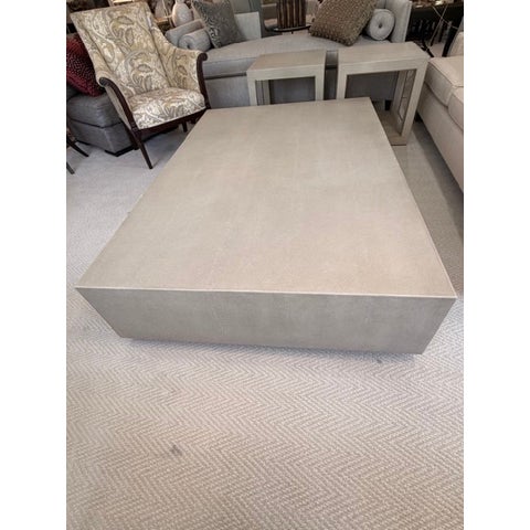 This oversized coffee table is in excellent condition and is covered in a creamy textured leather or a leather-like...