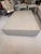 This oversized coffee table is in excellent condition and is covered in a creamy textured leather or a leather-like...