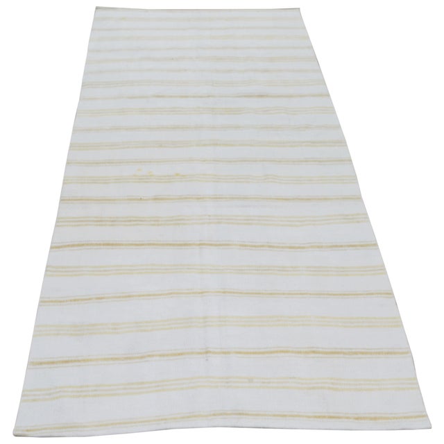 Flatweaved with care using traditional rug-making techniques, this wool rug blends timeless craftsmanship with a modern...