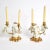 Whimsical pair of porcelain and gilt metal candelabra with swan-shaped figures at the center. These white and gold pieces...