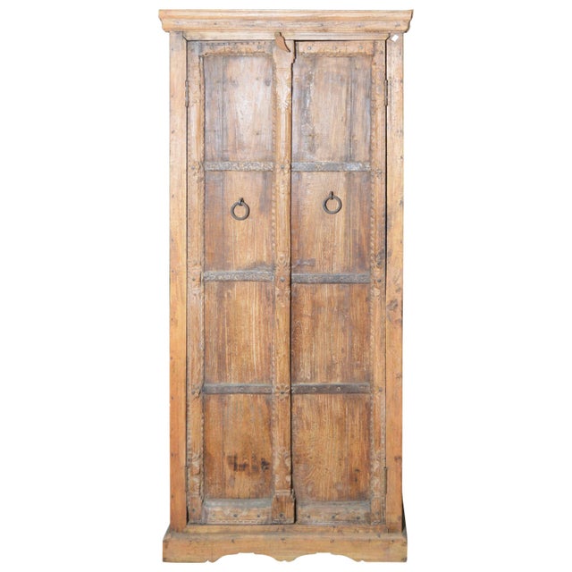 Indian Vintage Wooden Armoire With Metal Braces And Hand Carved