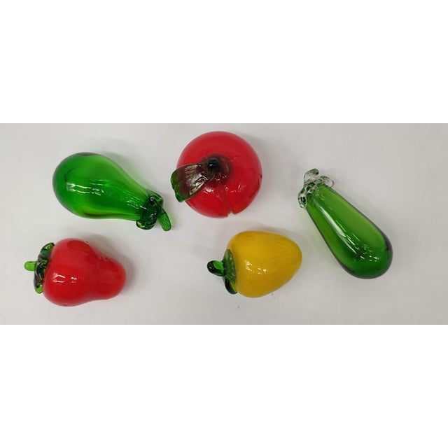 An excellently preserved, five-piece set of decorative glass fruits and vegetables from the mid-20th century. The set...