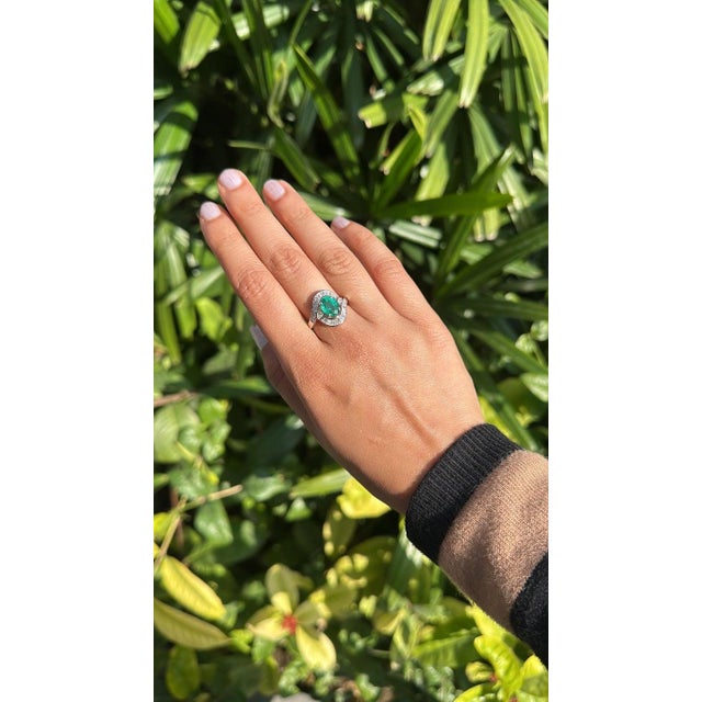 A very gorgeous and beautiful, Emerald Engagement Ring set in 18K Gold White Gold & natural Diamonds. The weight of the...