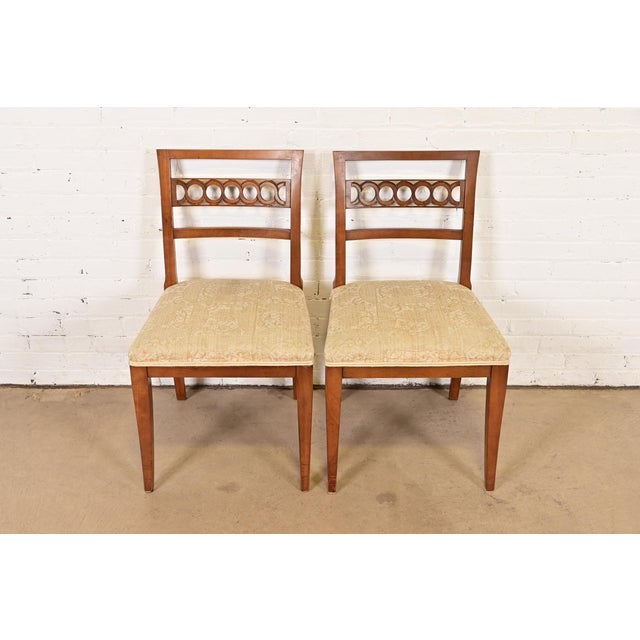 A beautiful pair of Regency or Neoclassical style side chairs or dining chairs By Kindel Furniture USA, Circa 1960s Solid...