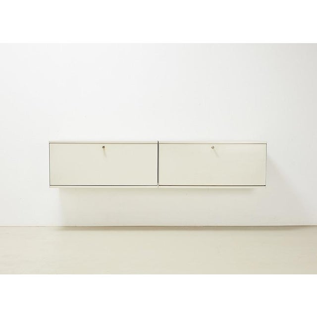 Iconic wall unit, model 606 Universal Shelving System, designed by Dieter Rams for Vitsoe in 1960. The 606 system won...