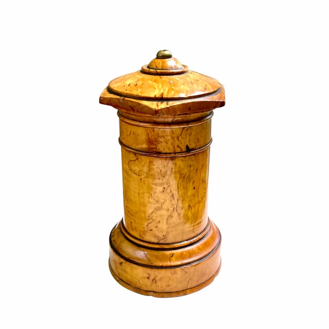A fine early 19th century Karelian birch spice box, probably Russian, circa 1820. The box in cylinder form is made of...