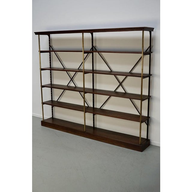 This shelving unit by Theodore Scherf was made in France around the late 19th century. It features four solid oak shelves.