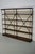 This shelving unit by Theodore Scherf was made in France around the late 19th century. It features four solid oak shelves.