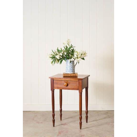 Solid cherry side table featuring a single dovetailed drawer, turned legs, and a warm aged patina. American made, circa...