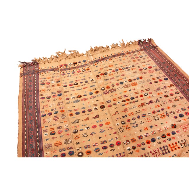 Originating from Persia in 1920, this antique Persian wool kilim. Recognizable by the vertical lines in its borders...