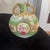 An exquisite antique French porcelain pilgrim flask-style canteen vase featuring a beautifully compressed globular form....