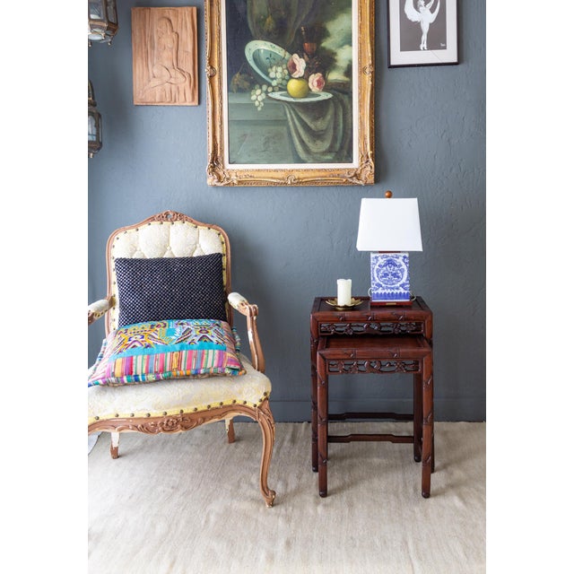 This set of two Asian nesting tables features rich and sturdy rosewood frames, carved into faux bamboo legs that terminate...