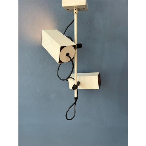 Philips vintage downrod ceiling lamp with 2 rectangular spots. The metal spots easily be redirected. The lamp requires two...