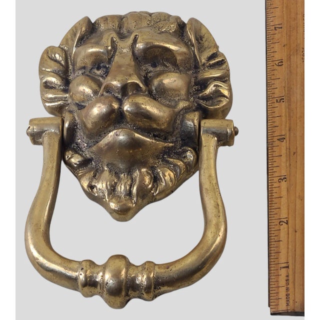 Vintage Brass Lion Door Knocker. Good condition, measuring 7 1/4'' High 6'' Wide 3'' Deep. Please view photos for detail...