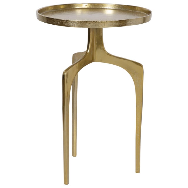 The unique design of this accent table features three curved legs and a solid round top, which is accented with a .75"...