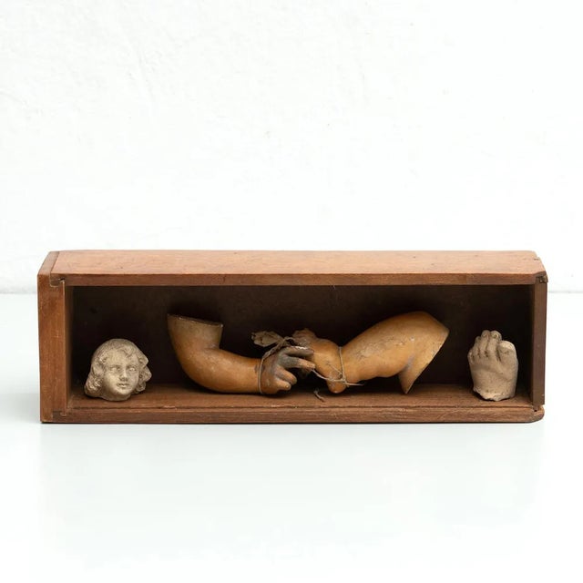 Cabinet of curiosities of plaster figures and pieces in a wooden drawer. Made in traditional Catalan atelier in Olot,...