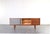 This Danish sideboard from the 1960s is a classic example of mid-century modern design, where simplicity of form is...