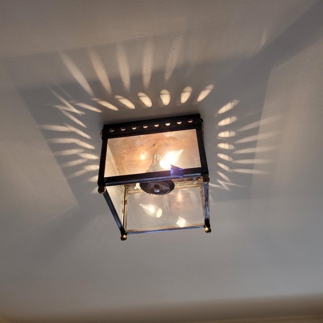 This flush mount fixture is a truly unique fixture that is a recreation of an old style of light with a suspended crimped...