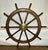 Very large ships wheel with polished brass outer ring and large brass hub. This is a twelve spoke giant of a wheel. Great...