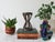 Vintage hand carved wood African decorative object with hands. No makers mark. Some age wear to wood. Pictured.