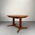 Danish teak dining table by Dyrlund with a superellipse-shaped tabletop. The solid wood table features a 44cm extension...
