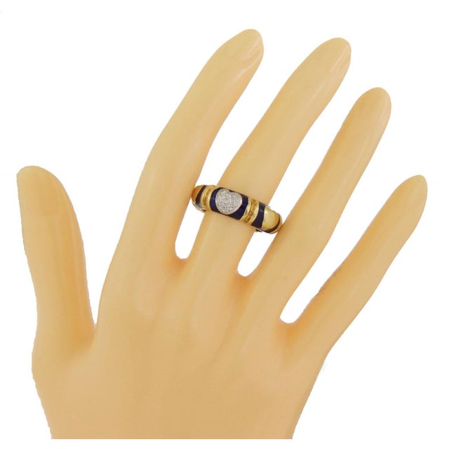 This lovely dome band ring is crafted from 14k yellow gold with white gold accent. Around the entire band is yellow gold...
