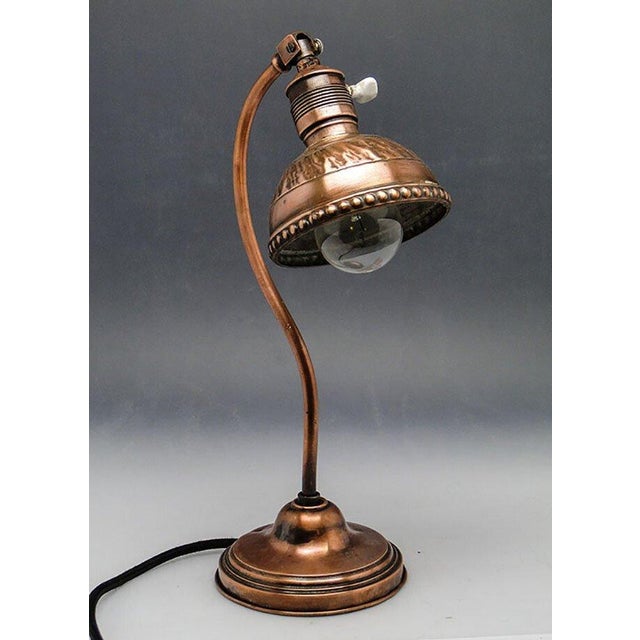 Table lamp, manufactured in Germany. It is made of copper and brass. It is preserved in good condition, has small traces...