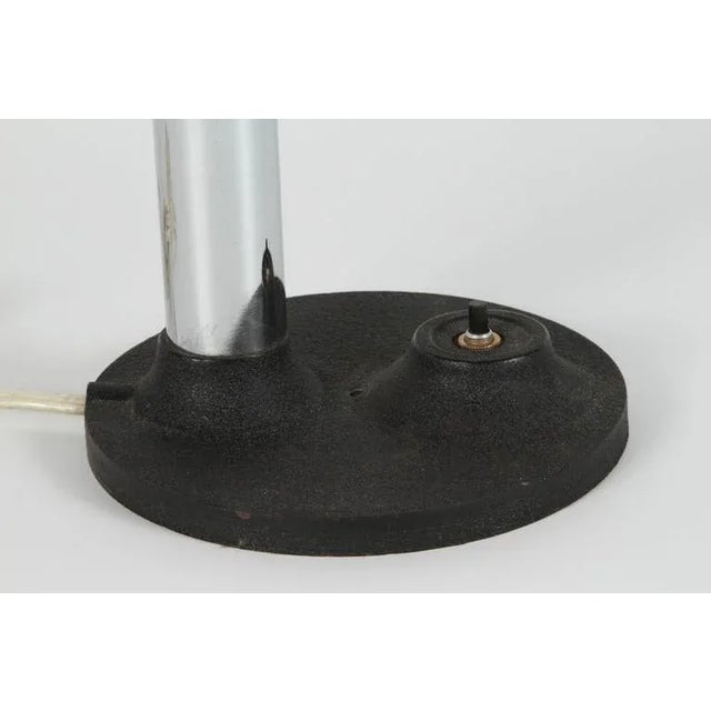 Modernist enameled bright yellow gooseneck desk lamp with black iron base. Snake desk style lamp, the tube is flexible and...