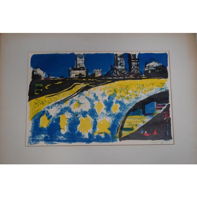 This striking and vibrant print captures an urban scene with a city skyline and bridge in the background. Reflecting a...