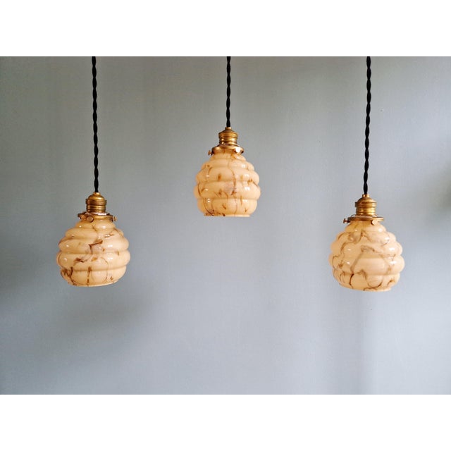 Art deco pendant light in marbled opaline glass with uranium glass, produced at the scailmont glassworks (belgium) in the...