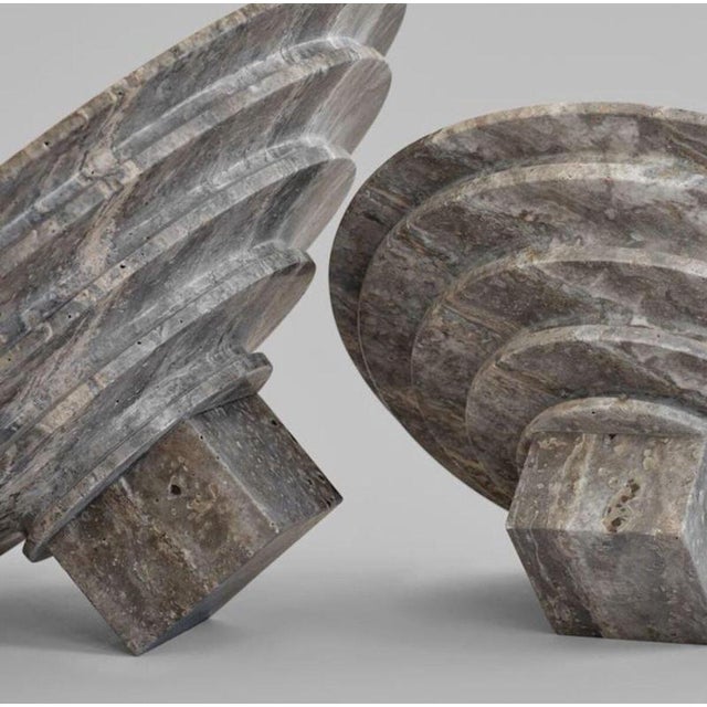 Silver travertine sculptural tray combines a functional serving surface with a stepped architectural form inspired by...