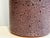 Handcrafted, cylindrical ceramic vase from the Römhild pottery workshop in Thuringia, dating from the 1960s. The satin-...