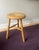 Rustic wooden bohemian style stool or side table with three legs. Fully stable with patina and signs of wear and age....