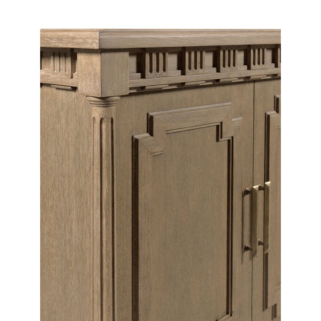 Crafted with meticulous attention to detail, this media cabinet stands out with its timeless dental molding. This cabinet...