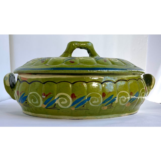 A beautiful and rustic Tonala or San Pedro Tlaquepaque hand-made and hand-painted low-fire terracotta lidded casserole...