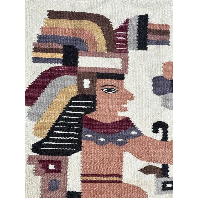 Pretty small Mexican tapestry with beautiful tribal design and nice colours with orange, purple, yellow and black, on a...