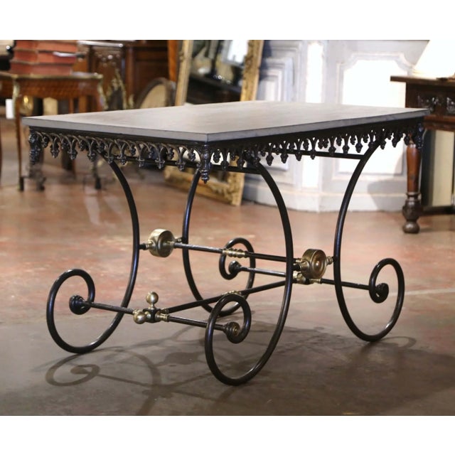 This handsome antique pastry table was crafted in France circa 1920 and combines an elegant wrought-iron base with a...